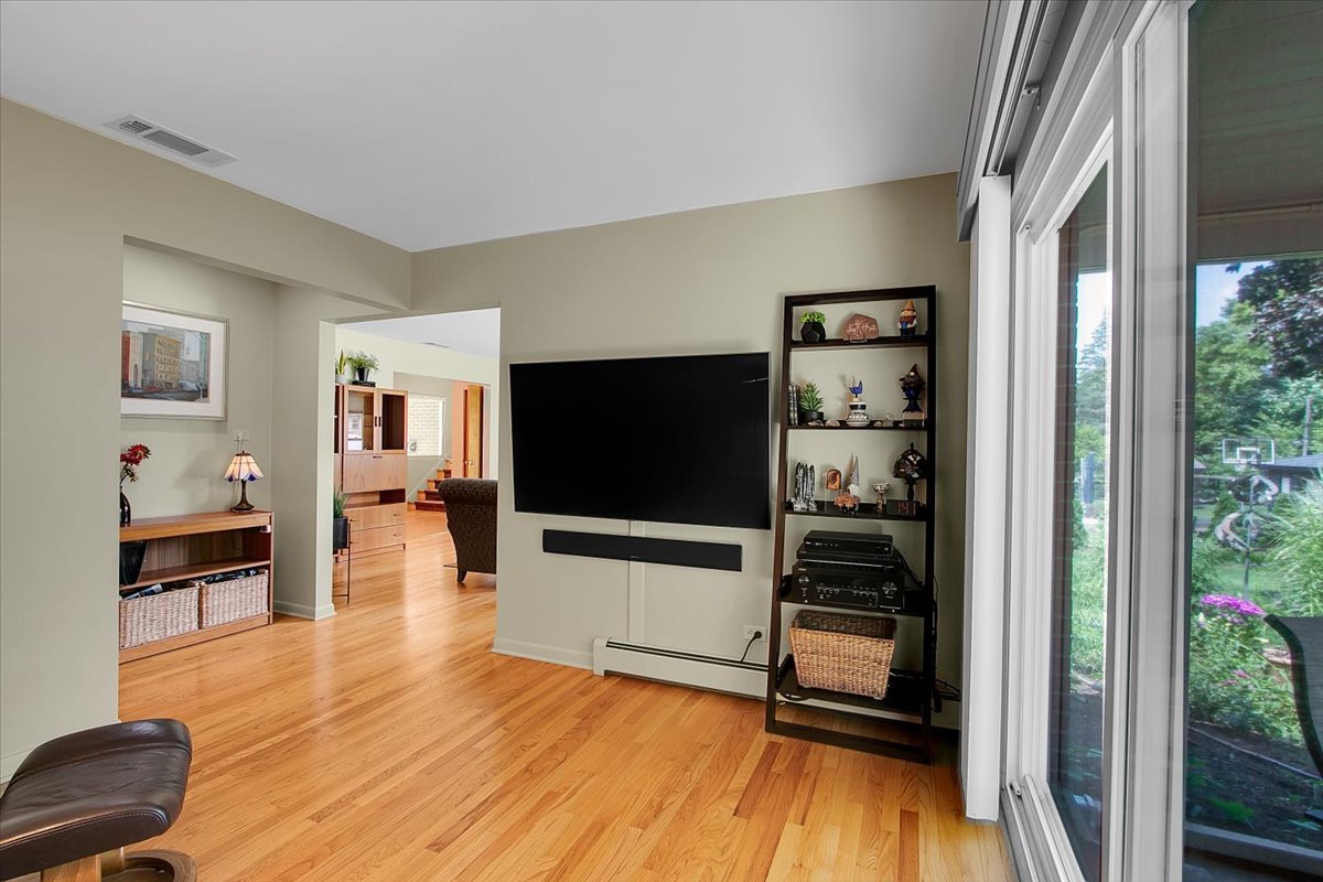 443 Lombard Road Itasca, IL 60143 - Photo 14 of 43 a living room with furniture and a flat screen tv
