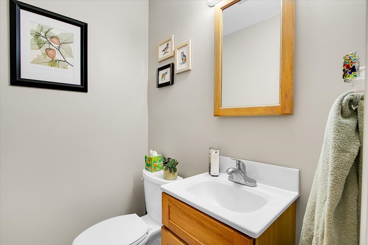 443 Lombard Road Itasca, IL 60143 - Photo 15 of 43 a bathroom with a sink mirror and toilet