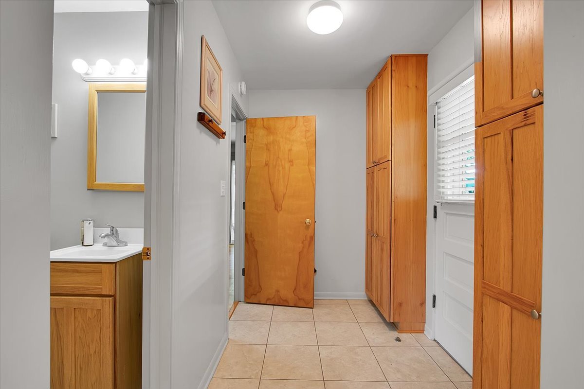 443 Lombard Road Itasca, IL 60143 - Photo 16 of 43 a view of bathroom with a sink mirror and window