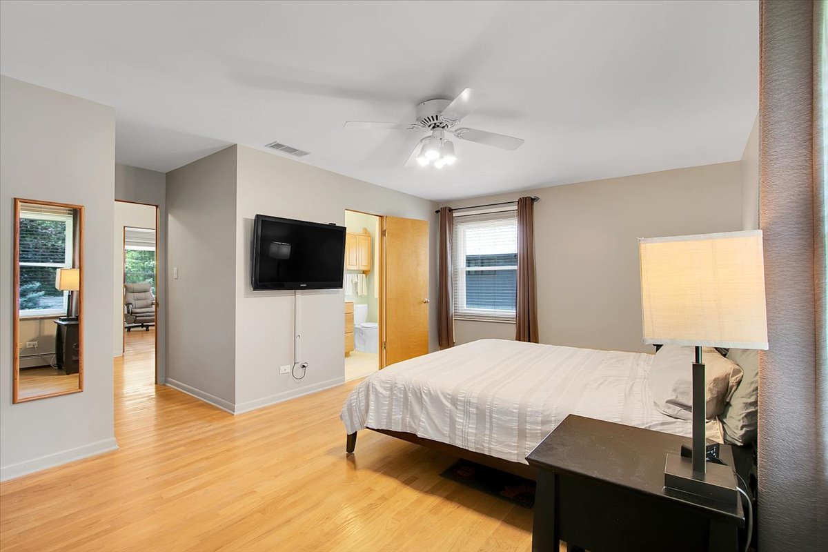 443 Lombard Road Itasca, IL 60143 - Photo 18 of 43 a bedroom with a bed and a flat screen tv