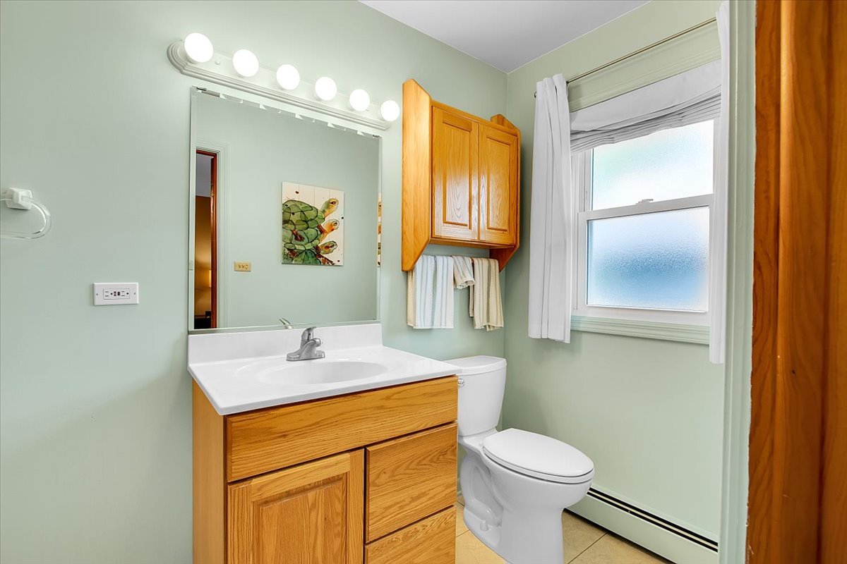443 Lombard Road Itasca, IL 60143 - Photo 20 of 43 a bathroom with a sink a toilet and vanity