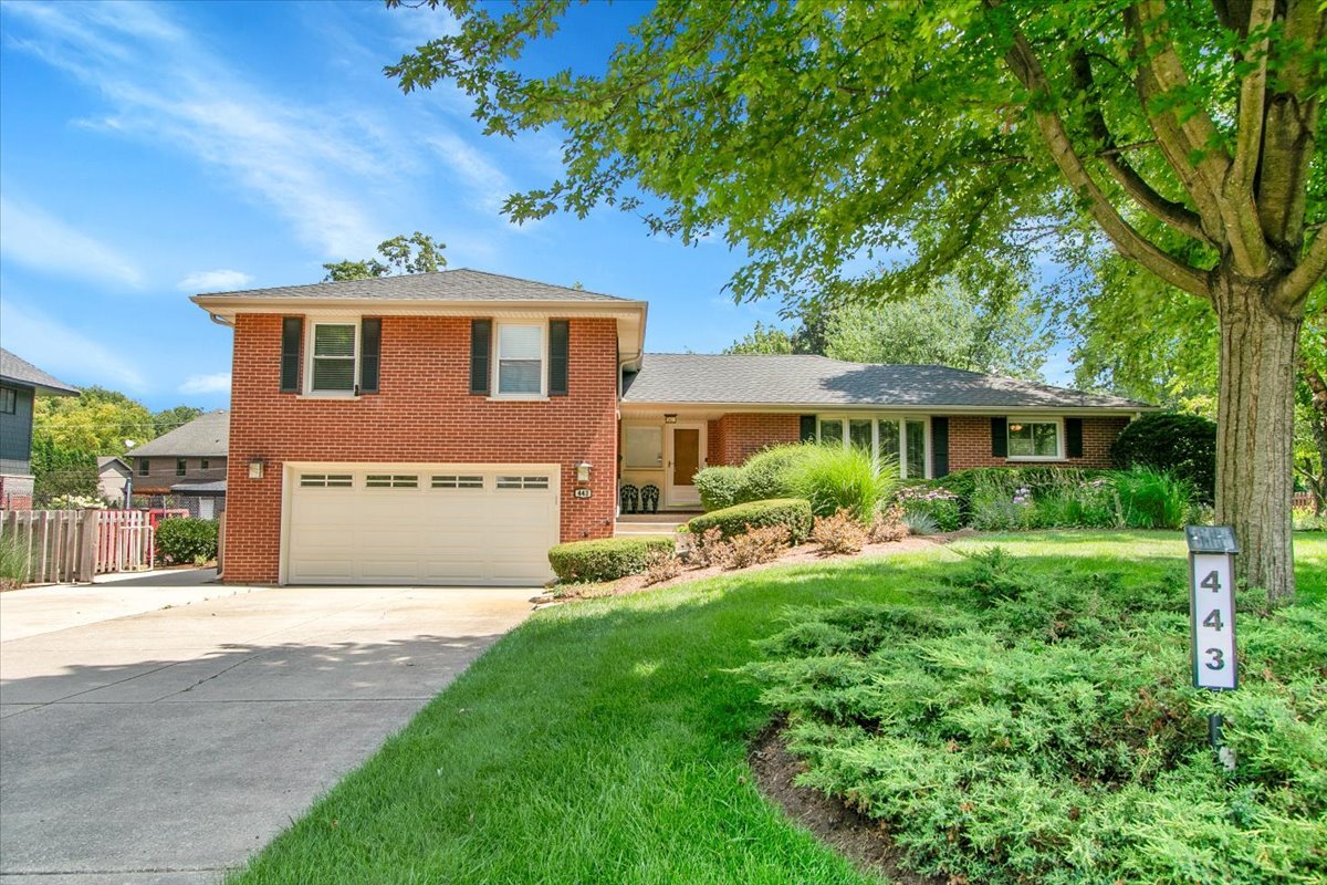 443 Lombard Road Itasca, IL 60143 - Photo 2 of 43 a front view of a house with a yard and porch