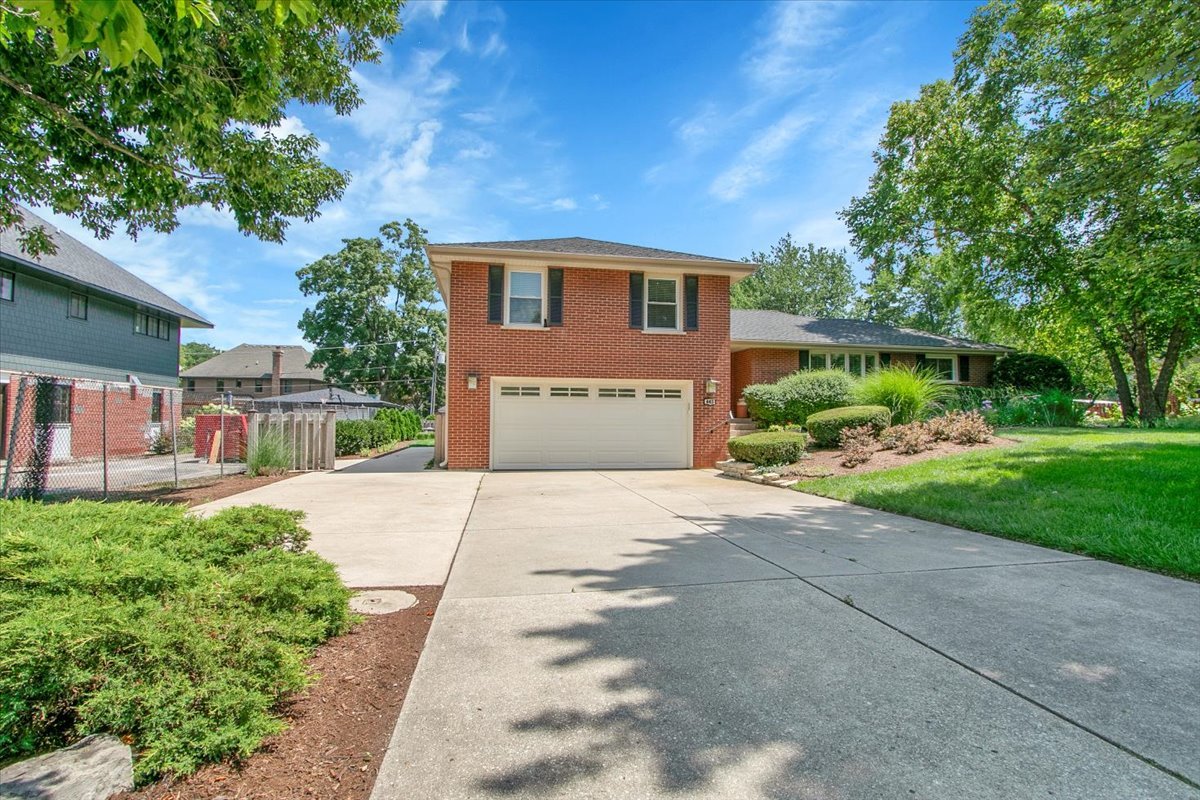 443 Lombard Road Itasca, IL 60143 - Photo 3 of 43 a front view of a house with a yard and trees
