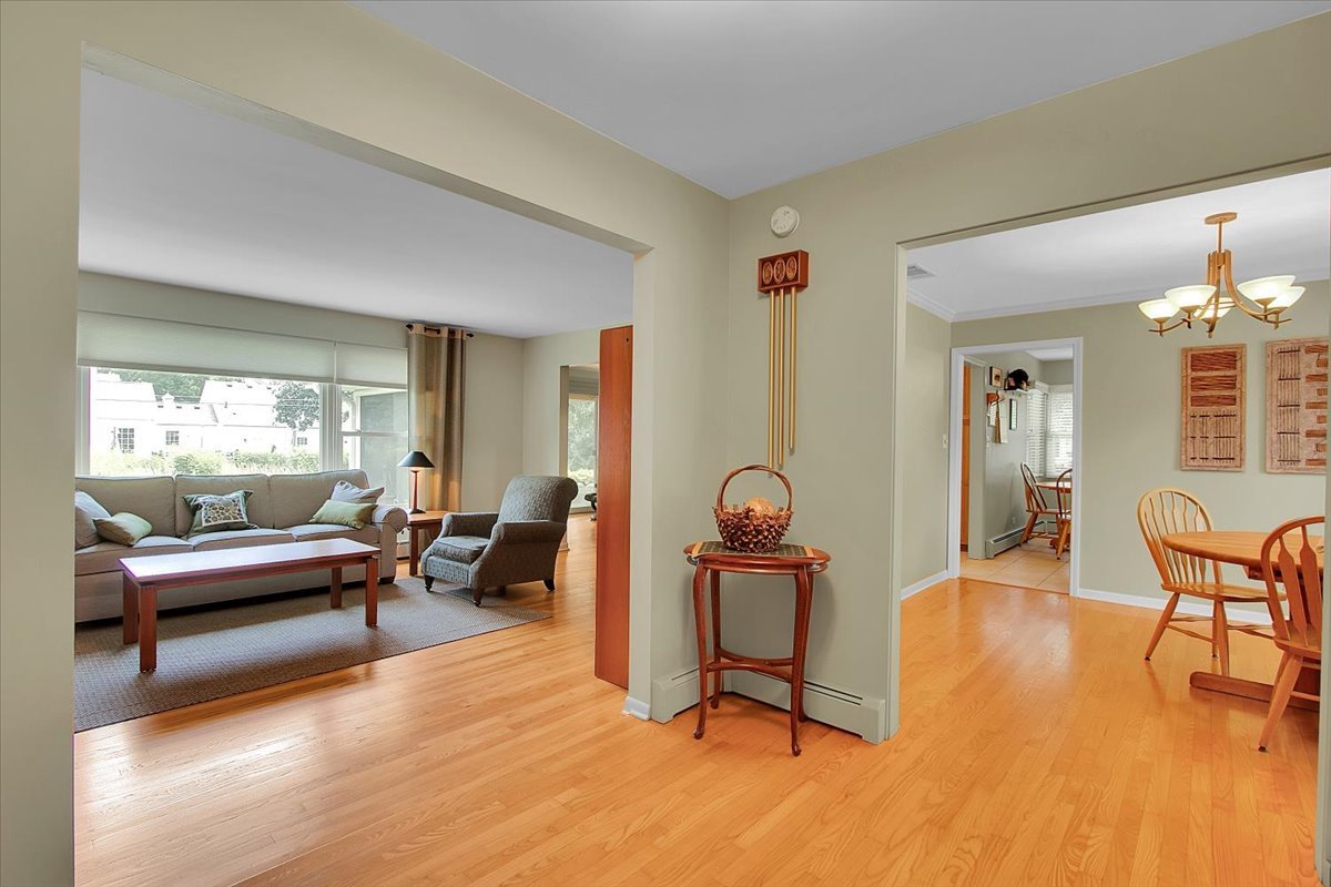 443 Lombard Road Itasca, IL 60143 - Photo 5 of 43 a living room with furniture and a wooden floor
