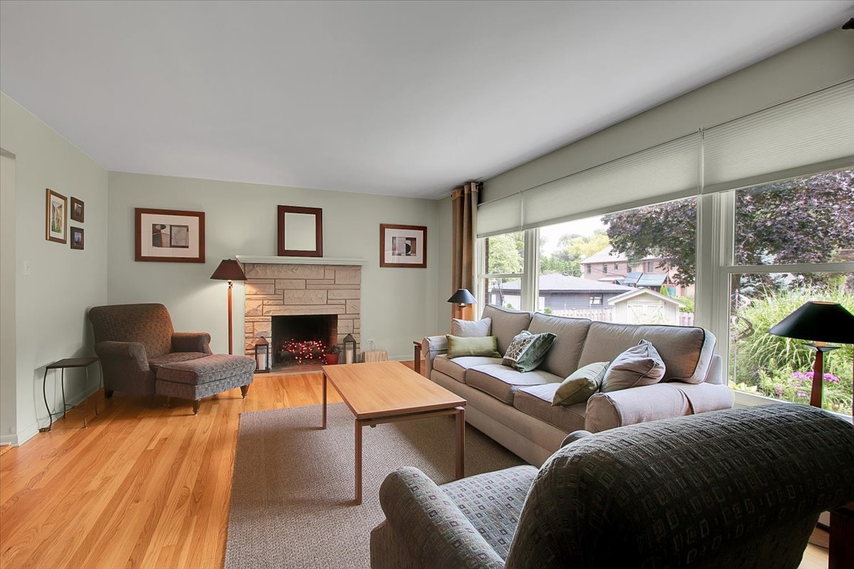 443 Lombard Road Itasca, IL 60143 - Photo 7 of 43 a living room with furniture large window and a fireplace