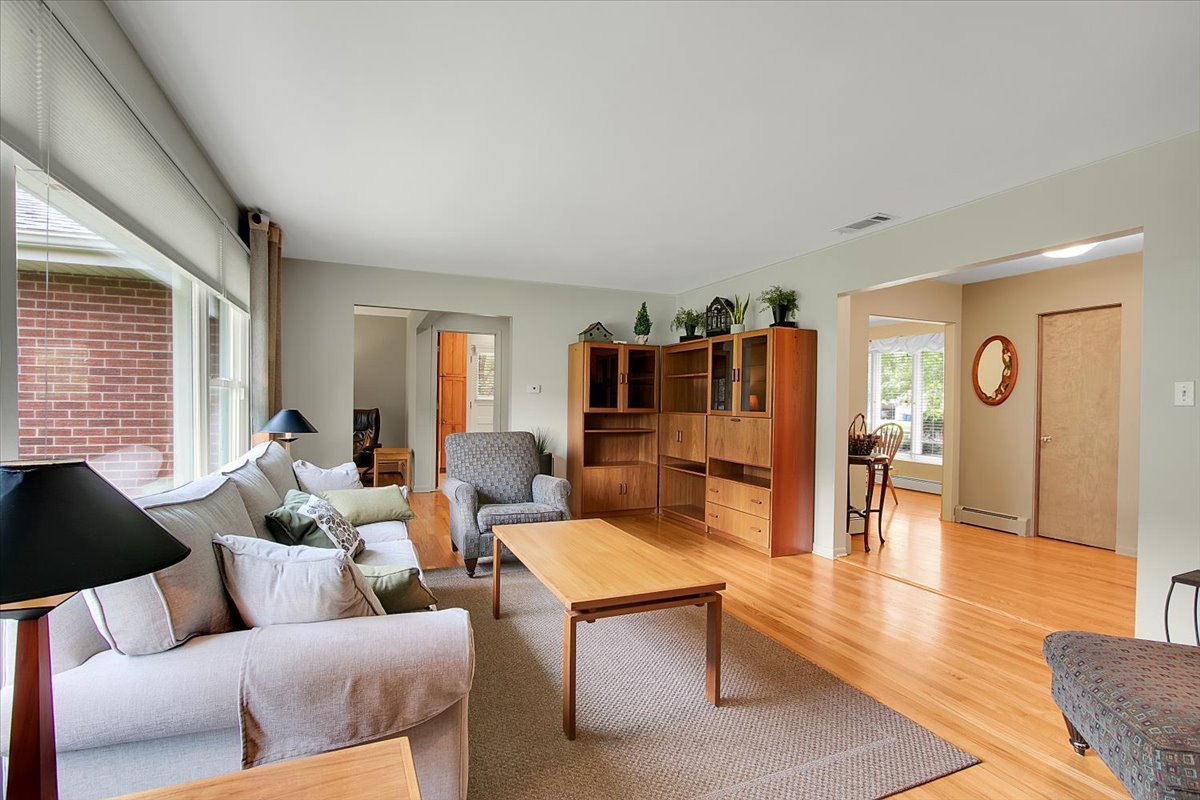 443 Lombard Road Itasca, IL 60143 - Photo 8 of 43 a living room with furniture and a table