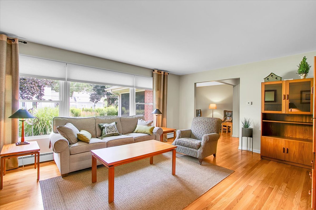 443 Lombard Road Itasca, IL 60143 - Photo 9 of 43 a living room with furniture and a wooden floor