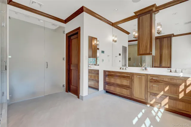 a bathroom with a double vanity sink and mirror