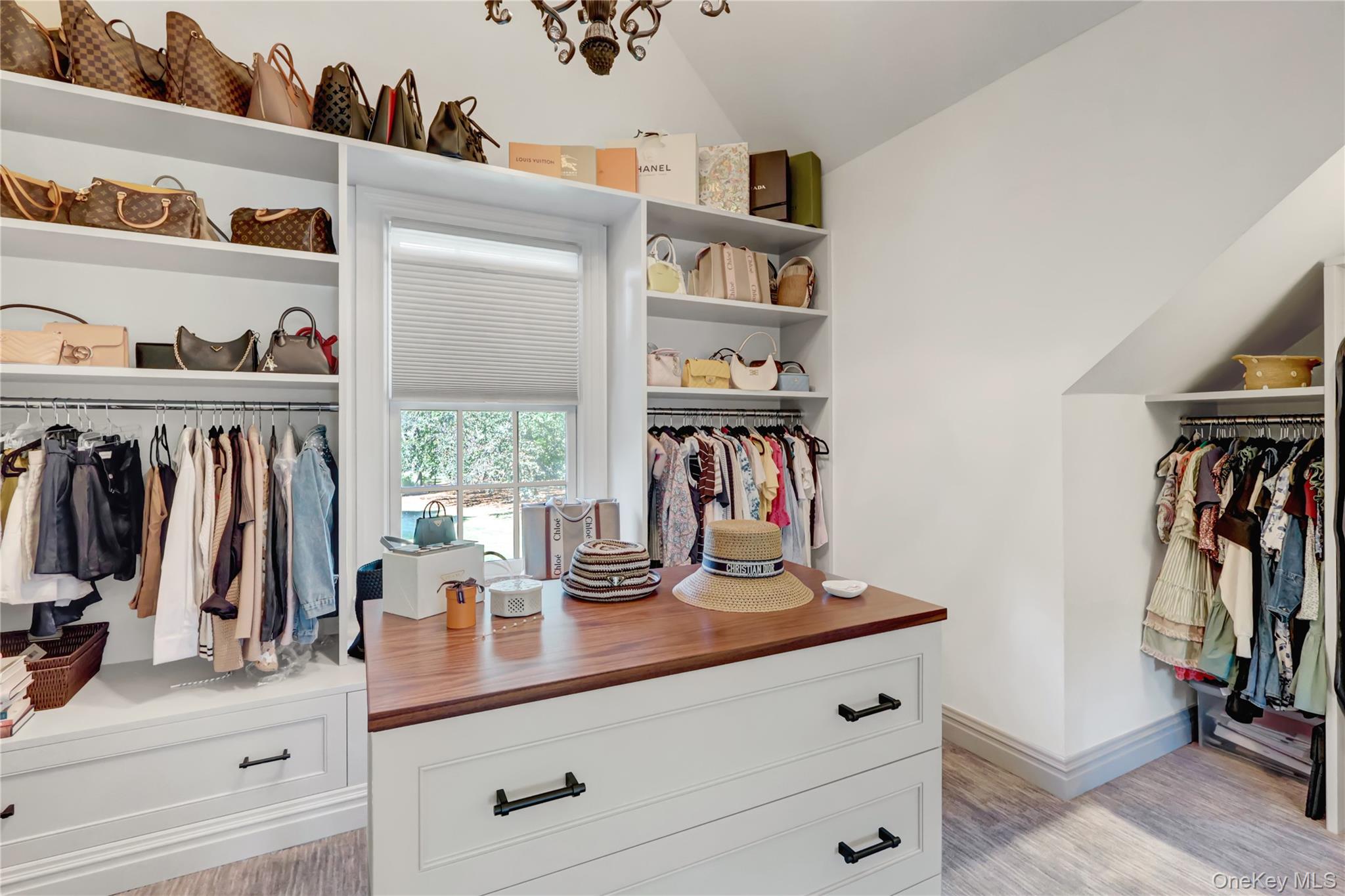 63 Dyke Road Setauket, NY 11733 - Photo 28 of 49 a view of walk in closet with clothes and shoes