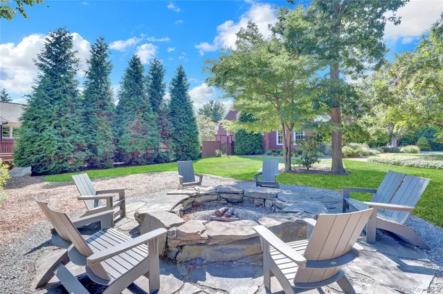 a view of a backyard with sitting area