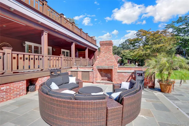 a view of a patio with wooden floor