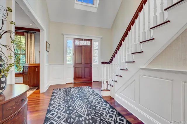 a view of an entryway with wooden floor