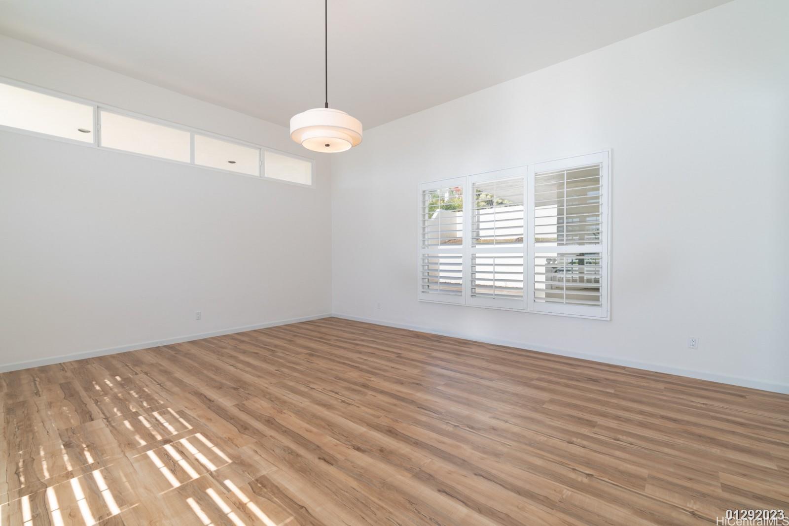 824 Ikena Circle Honolulu, HI 96821 - Photo 11 of 25 a view of a room with wooden floor and windows