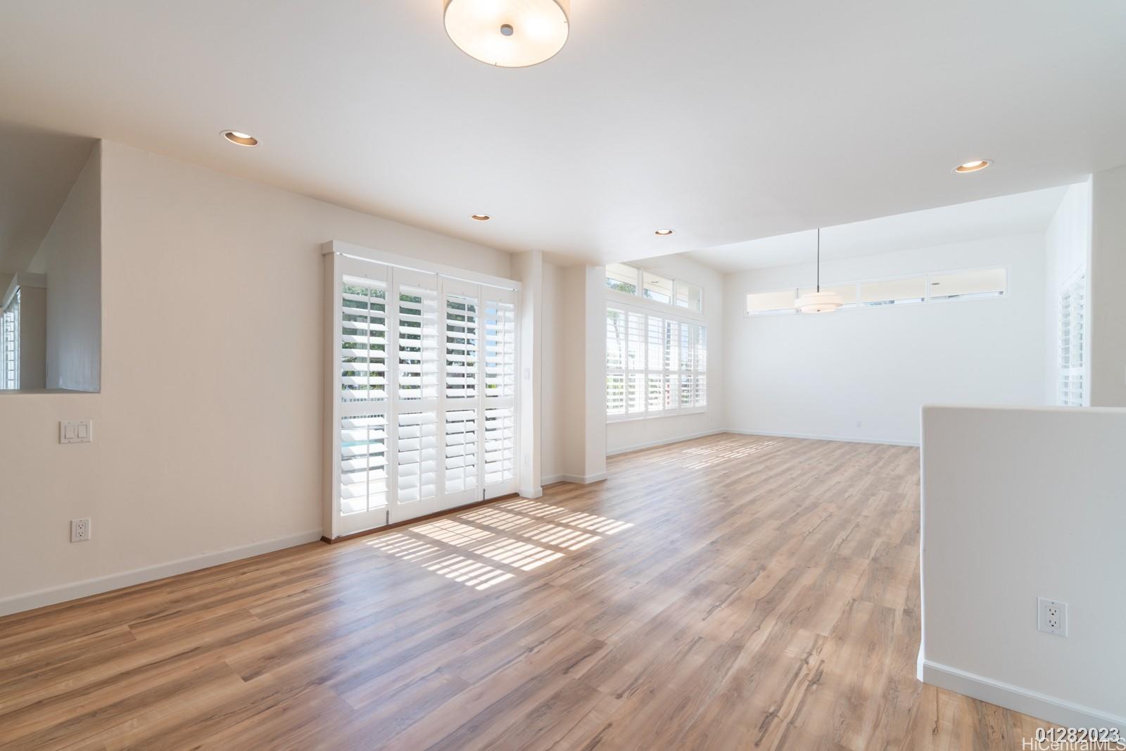 824 Ikena Circle Honolulu, HI 96821 - Photo 13 of 25 a view of an empty room with wooden floor and a window