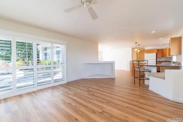 a view of kitchen with furniture and wooden floor