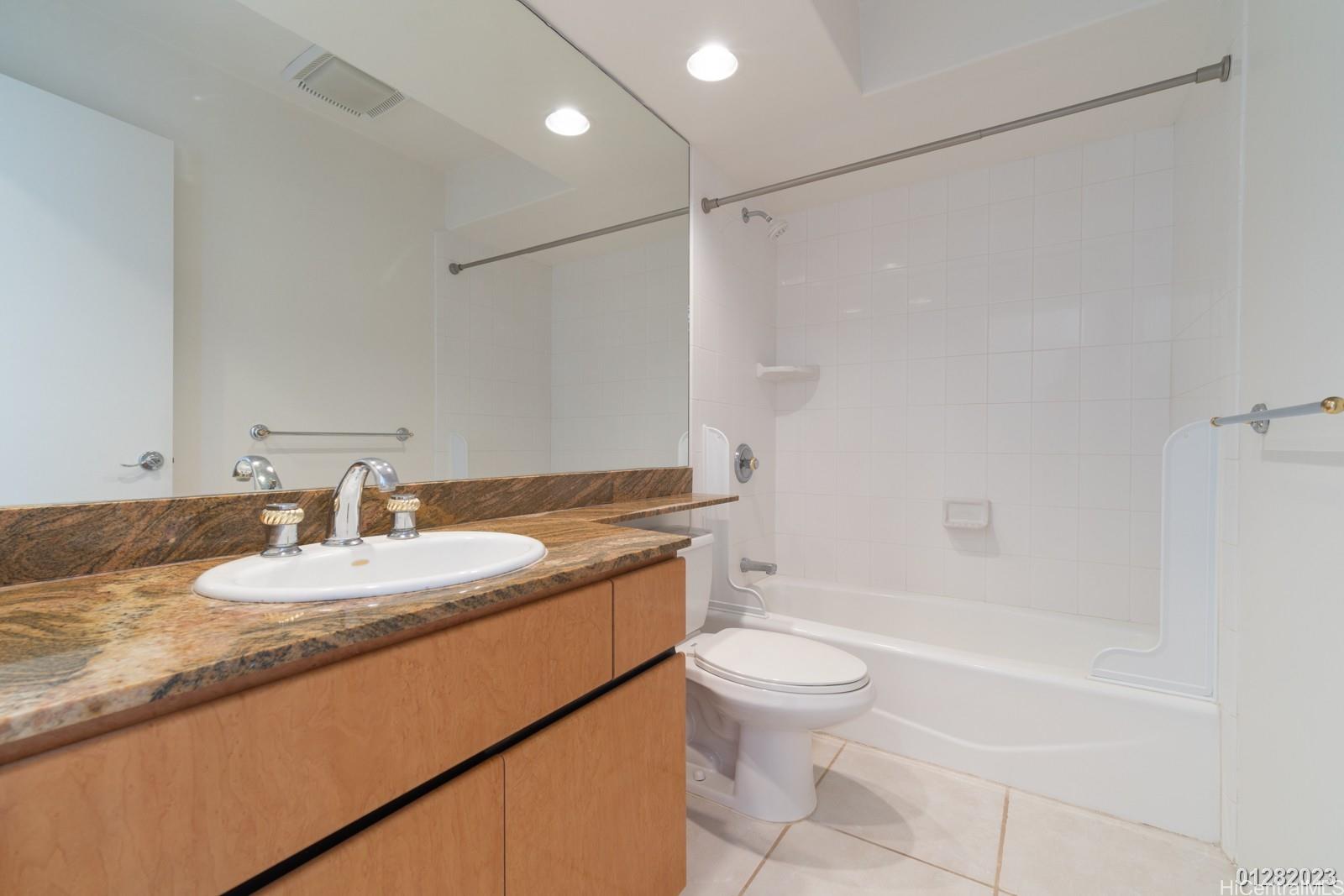 824 Ikena Circle Honolulu, HI 96821 - Photo 21 of 25 a bathroom with a granite countertop sink a toilet and shower