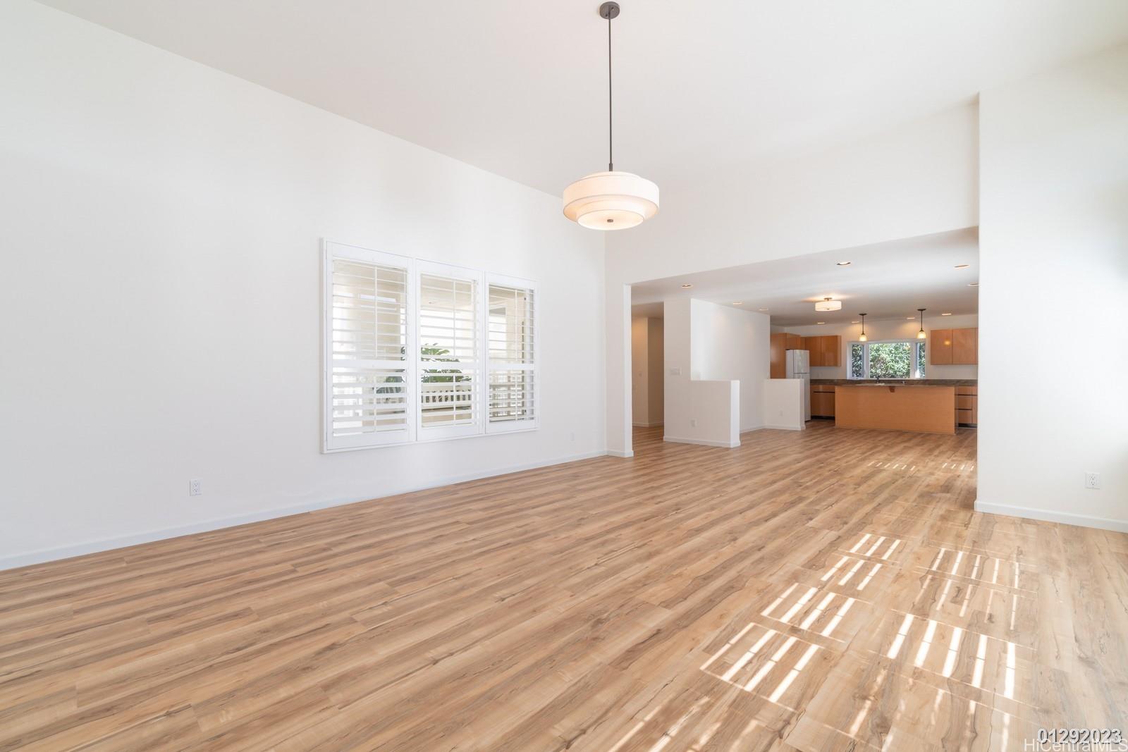 824 Ikena Circle Honolulu, HI 96821 - Photo 10 of 25 a view of an empty room with wooden floor and a window