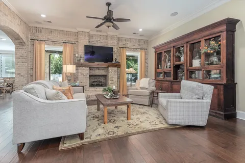 a kitchen with granite countertop white cabinets and stainless steel appliances