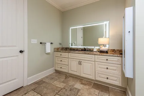 a view of a house with swimming pool and sitting area