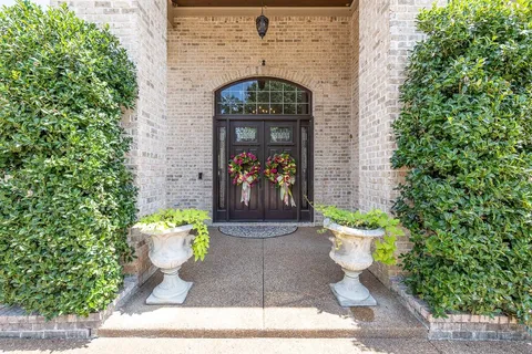 a view of a house with swimming pool and sitting area