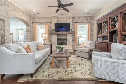 a kitchen with stainless steel appliances kitchen island granite countertop a refrigerator and a stove top oven