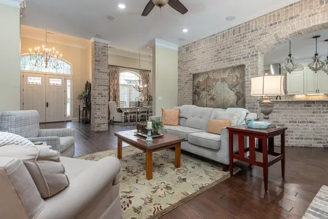 a living room with furniture fireplace and a flat screen tv