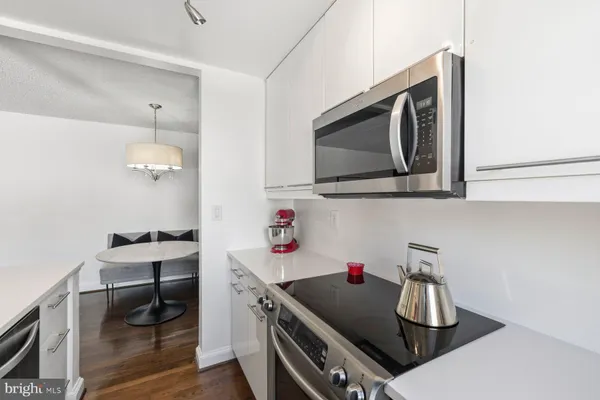 a kitchen with stainless steel appliances granite countertop a sink and stove top oven