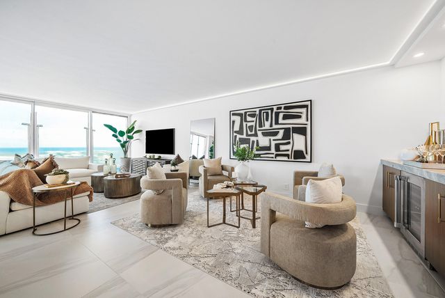a living room with furniture large window and flat screen tv
