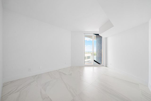 a bathroom with a toilet a sink a mirror a vanity and shower