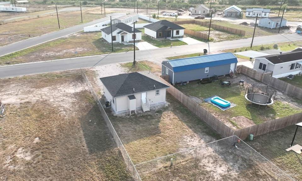 2736 Naples Street Weslaco, TX 78596 - Photo 14 of 14 a swimming pool with some trees in the background