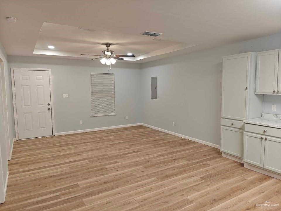 2736 Naples Street Weslaco, TX 78596 - Photo 5 of 14 a view of empty room with wooden floor and fan