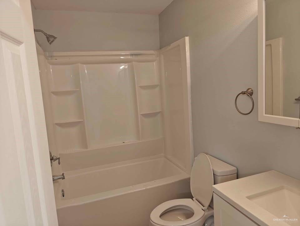 2736 Naples Street Weslaco, TX 78596 - Photo 6 of 14 a bathroom with a toilet and a shower