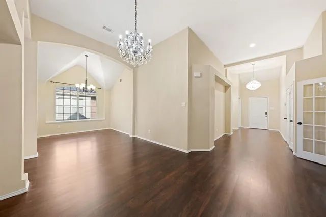 a view of livingroom with kitchen and hardwood