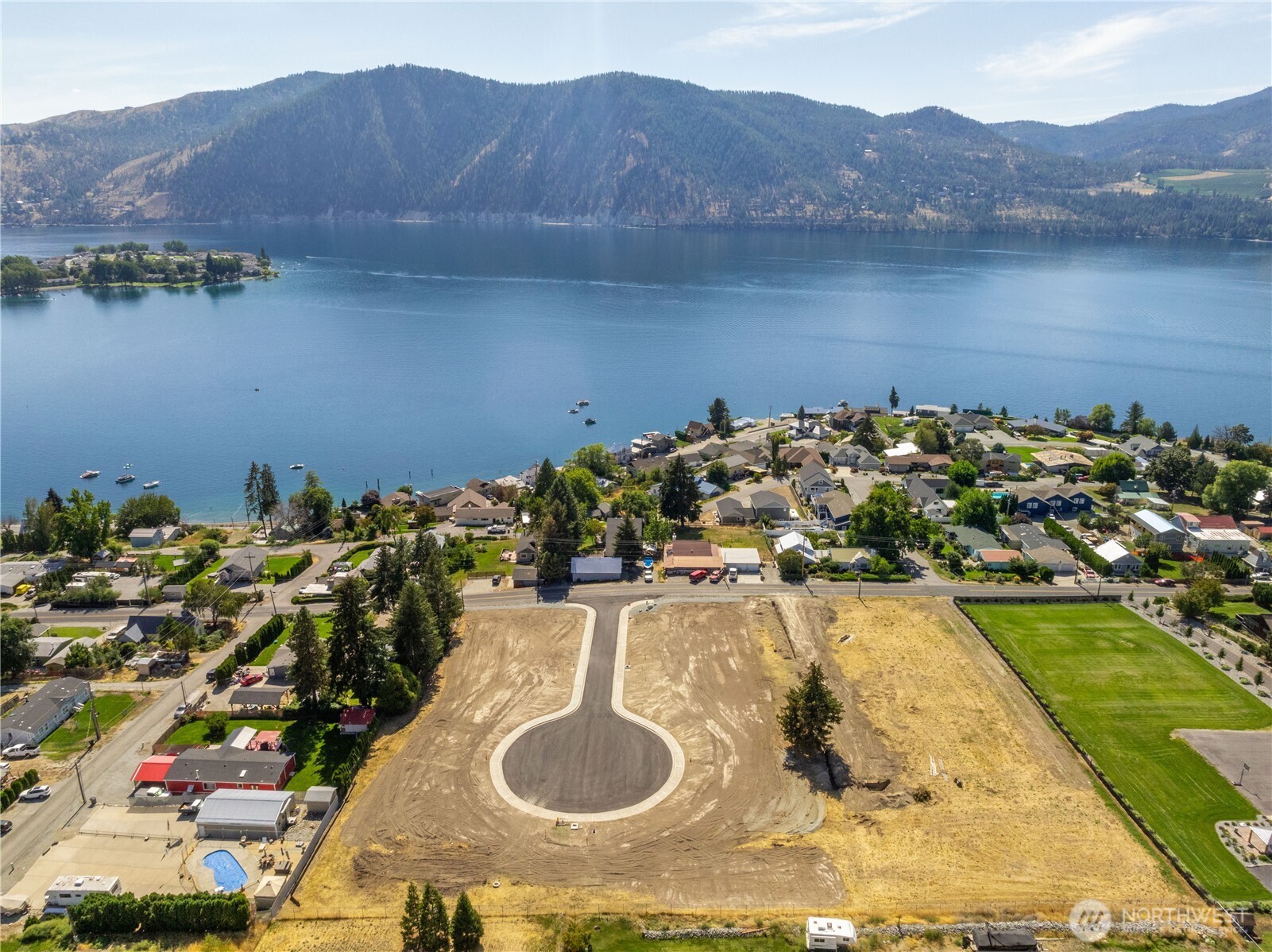 20 Indigo Lane Manson, WA 98831 - Photo 7 of 22 a view of a houses with a lake