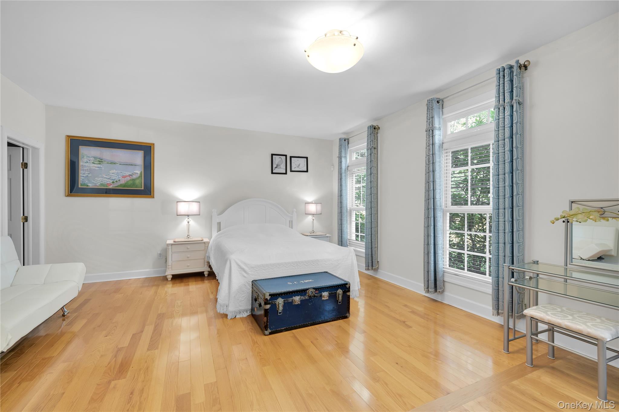 59 Orchard Hill Road Katonah, NY 10536 - Photo 11 of 27 a spacious bedroom with a bed and a large window