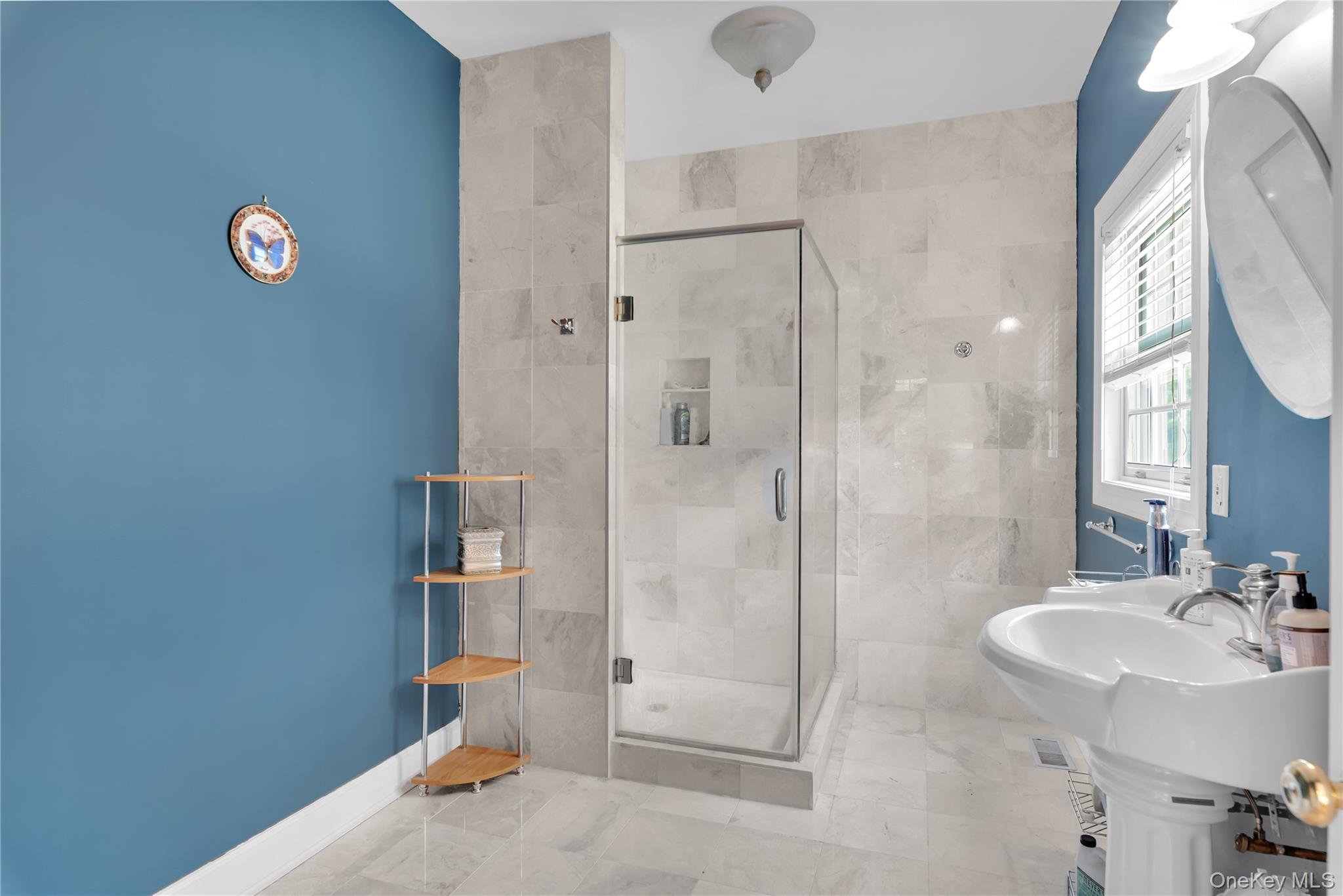59 Orchard Hill Road Katonah, NY 10536 - Photo 12 of 27 a bathroom with a sink and a mirror