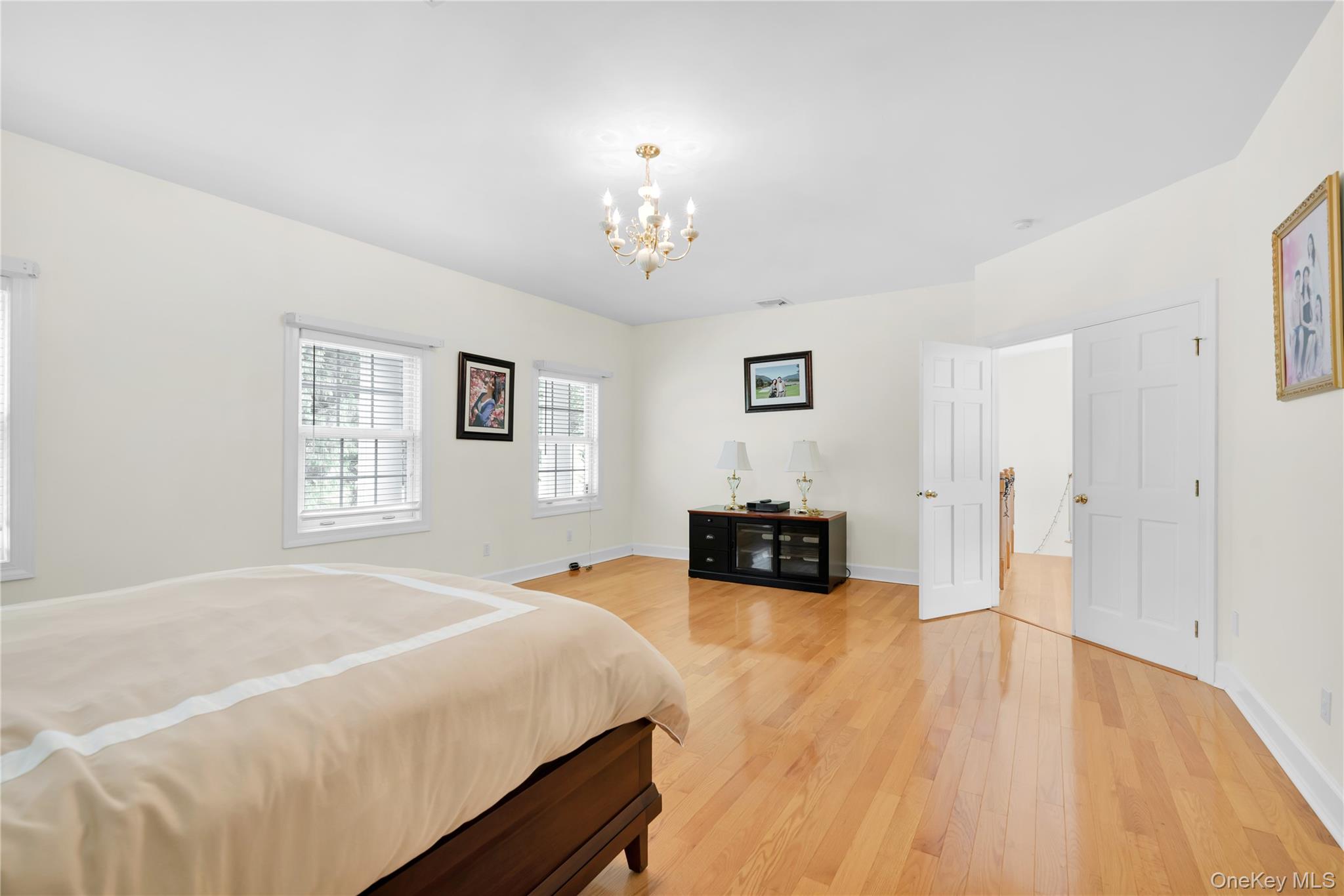 59 Orchard Hill Road Katonah, NY 10536 - Photo 13 of 27 a spacious bedroom with a bed and a couch