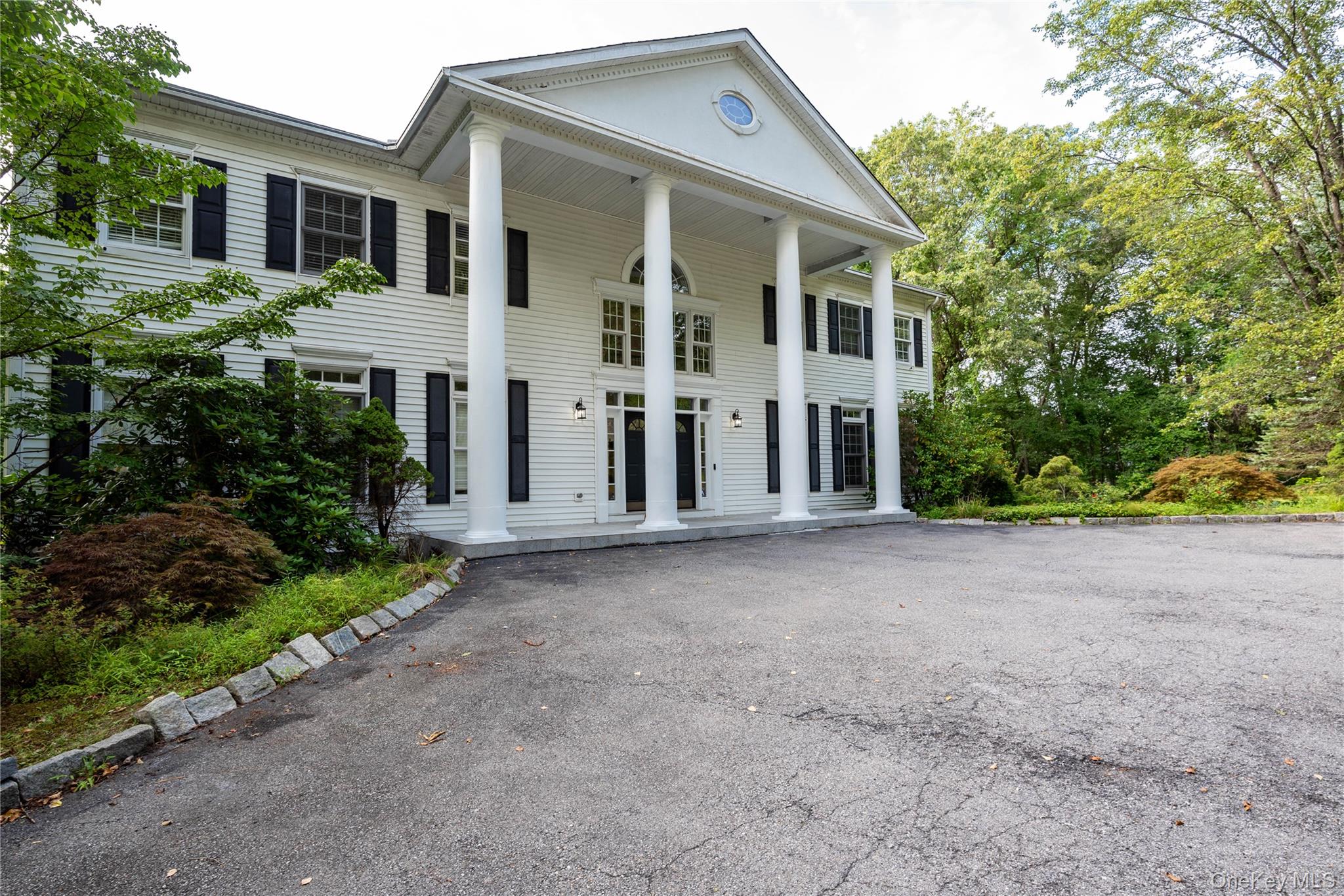 59 Orchard Hill Road Katonah, NY 10536 - Photo 27 of 27 a view of a house with a street