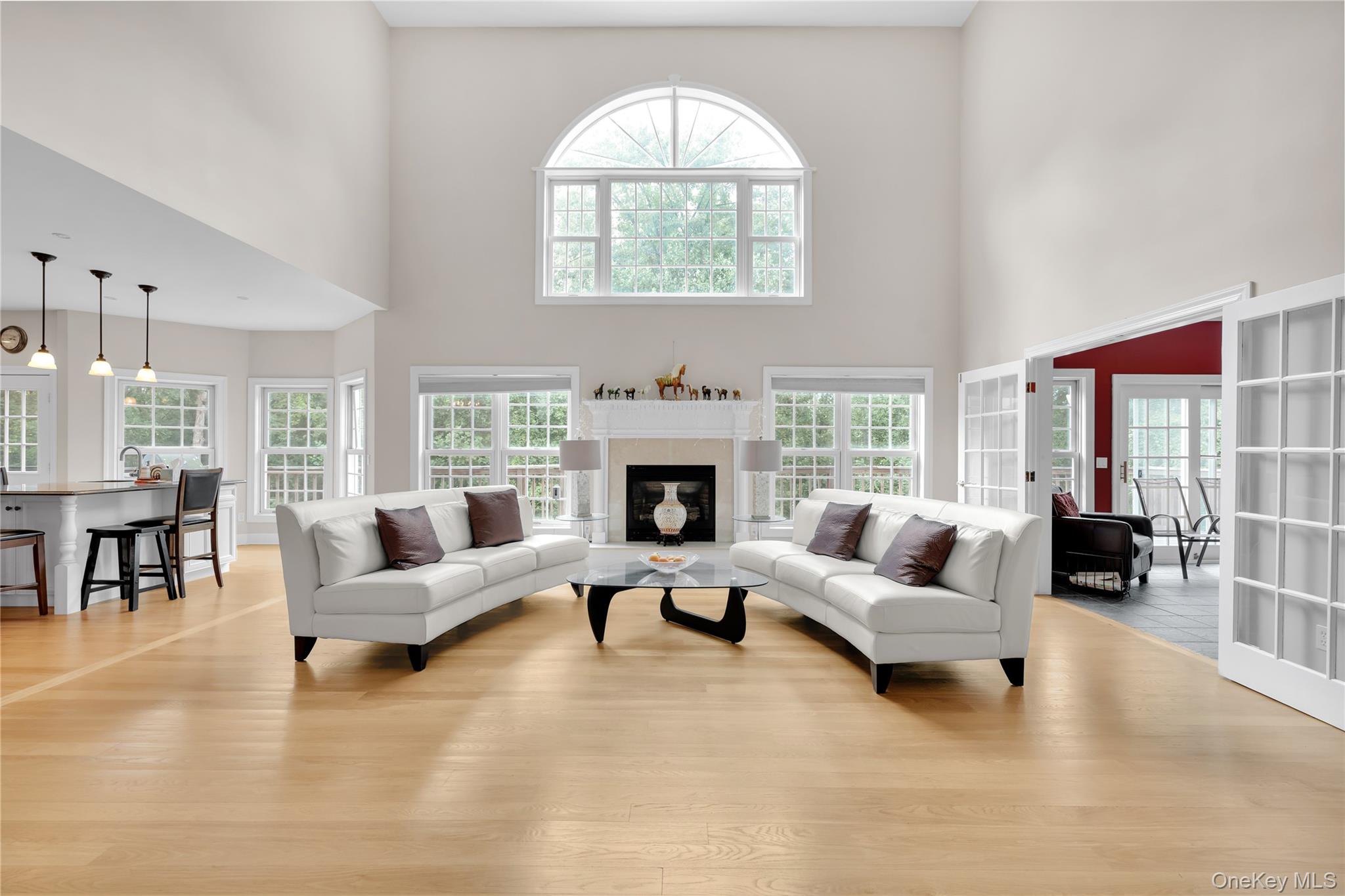 59 Orchard Hill Road Katonah, NY 10536 - Photo 7 of 27 a living room with furniture large window and a fireplace