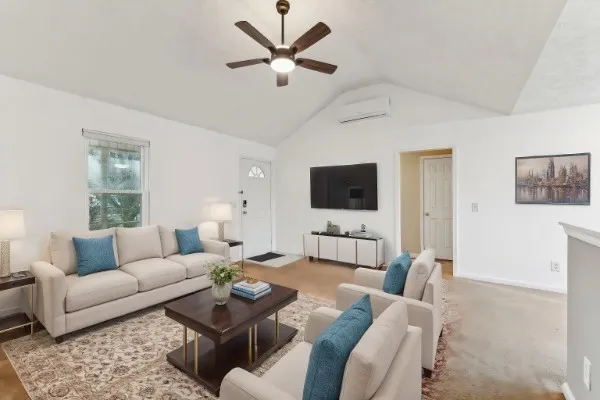 a living room with furniture and a flat screen tv