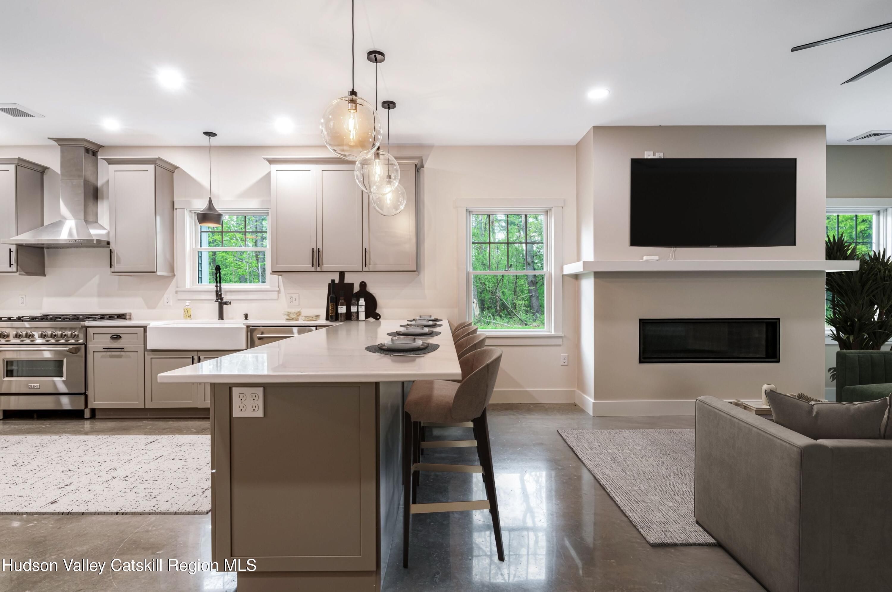 1980 Sleepy Hollow Road Athens, NY 12015 - Photo 11 of 40 a living room with stainless steel appliances furniture a fireplace and a flat screen tv