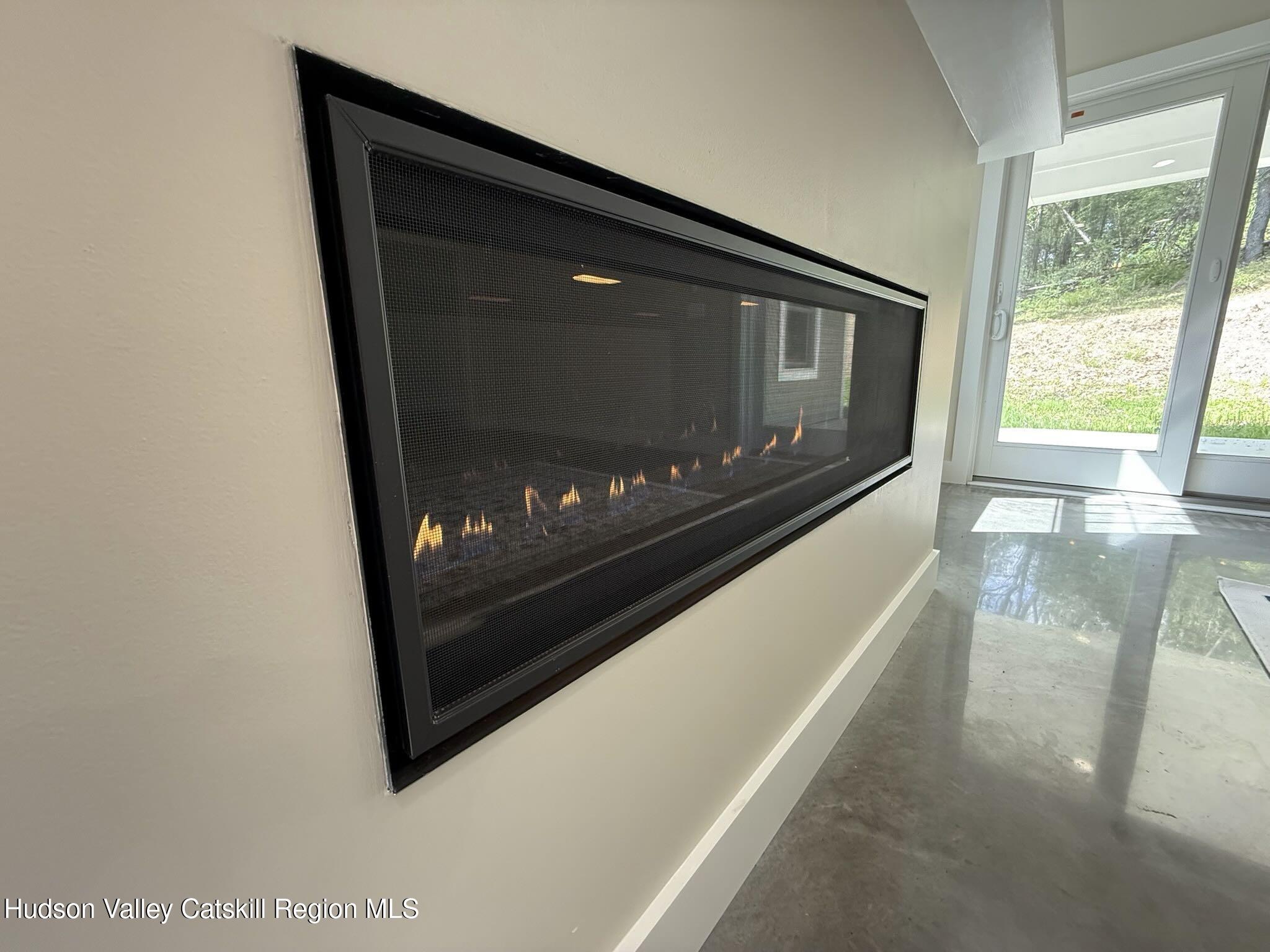 1980 Sleepy Hollow Road Athens, NY 12015 - Photo 14 of 40 a living room with a fireplace