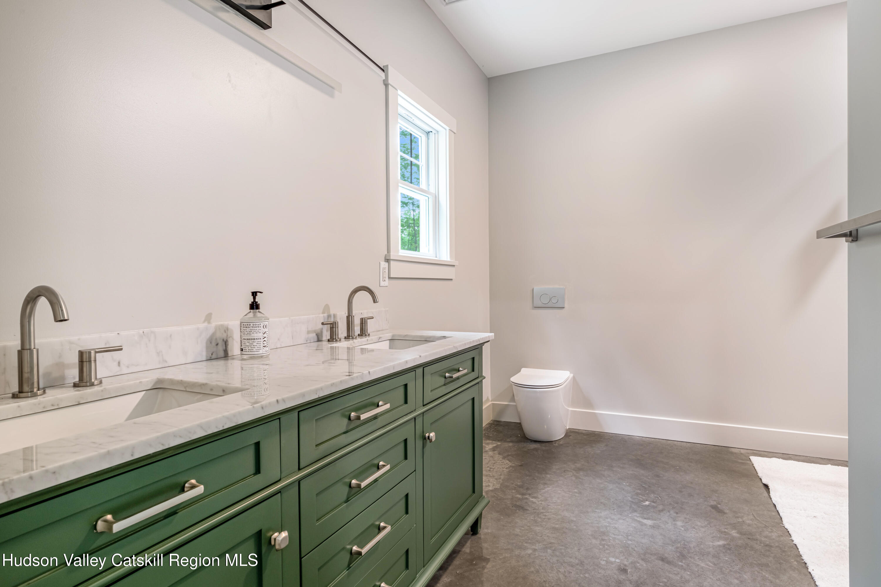 1980 Sleepy Hollow Road Athens, NY 12015 - Photo 17 of 40 a bathroom with a granite countertop sink a toilet and a mirror