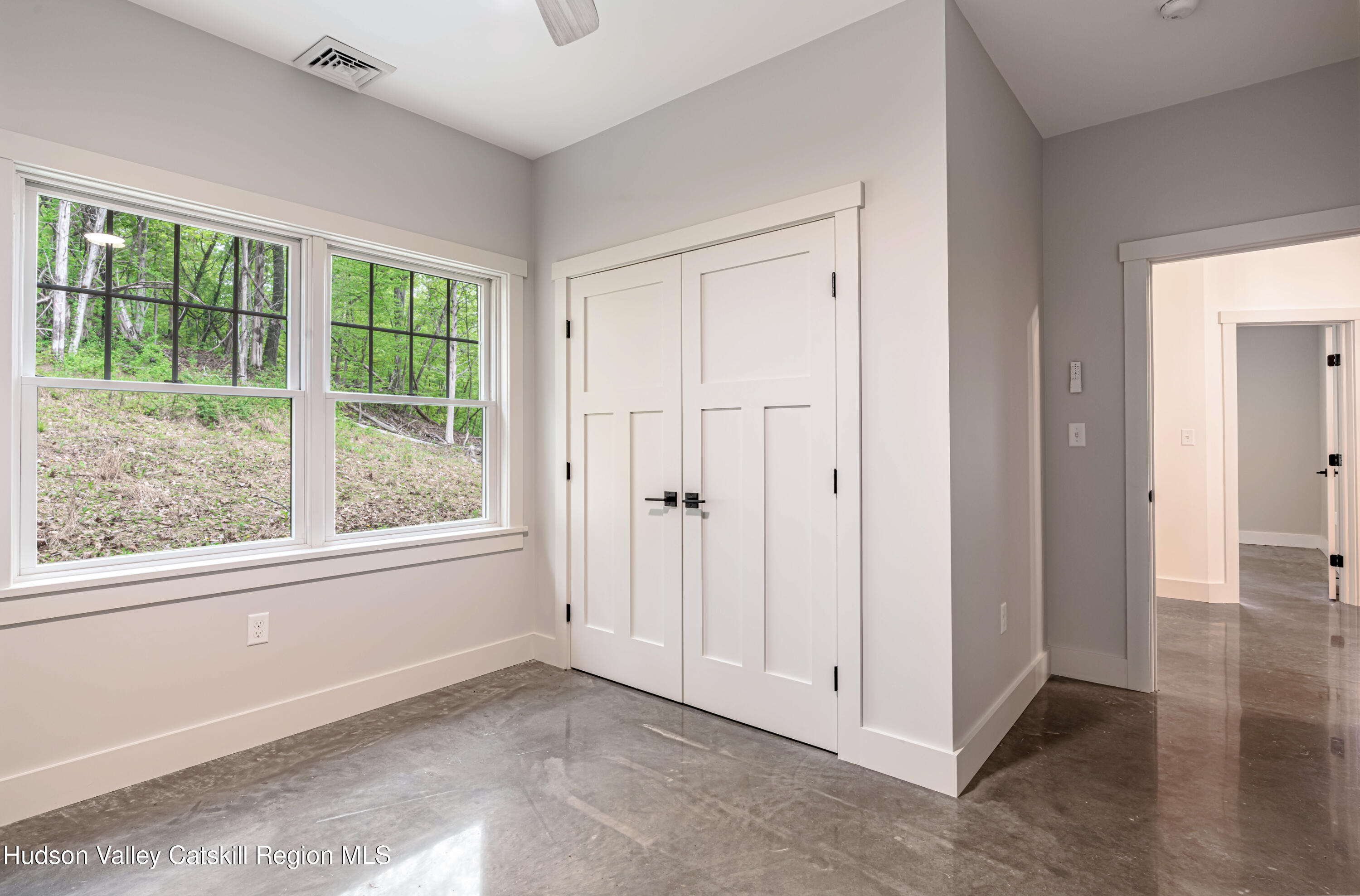 1980 Sleepy Hollow Road Athens, NY 12015 - Photo 20 of 40 an empty room with windows and closet
