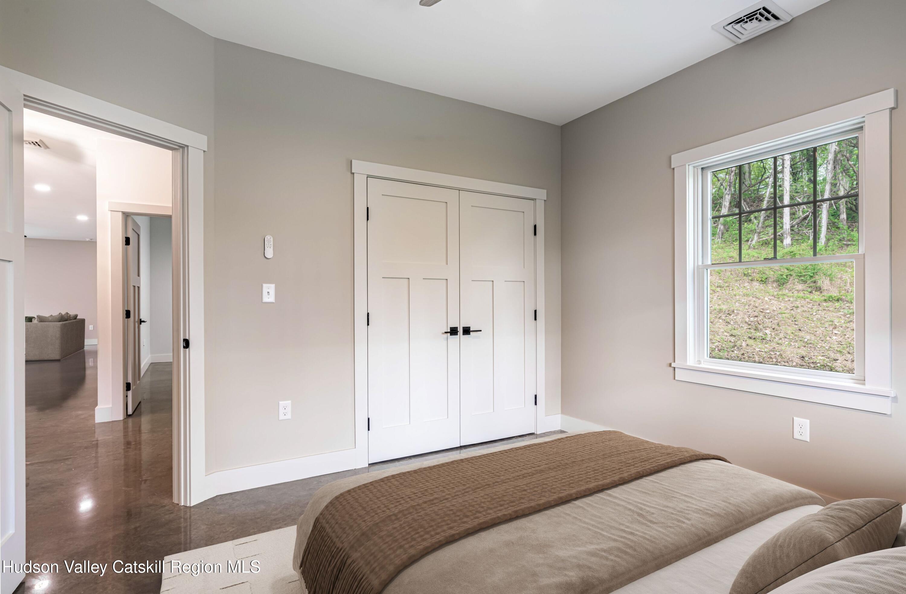 1980 Sleepy Hollow Road Athens, NY 12015 - Photo 22 of 40 a bedroom with a bed and a window