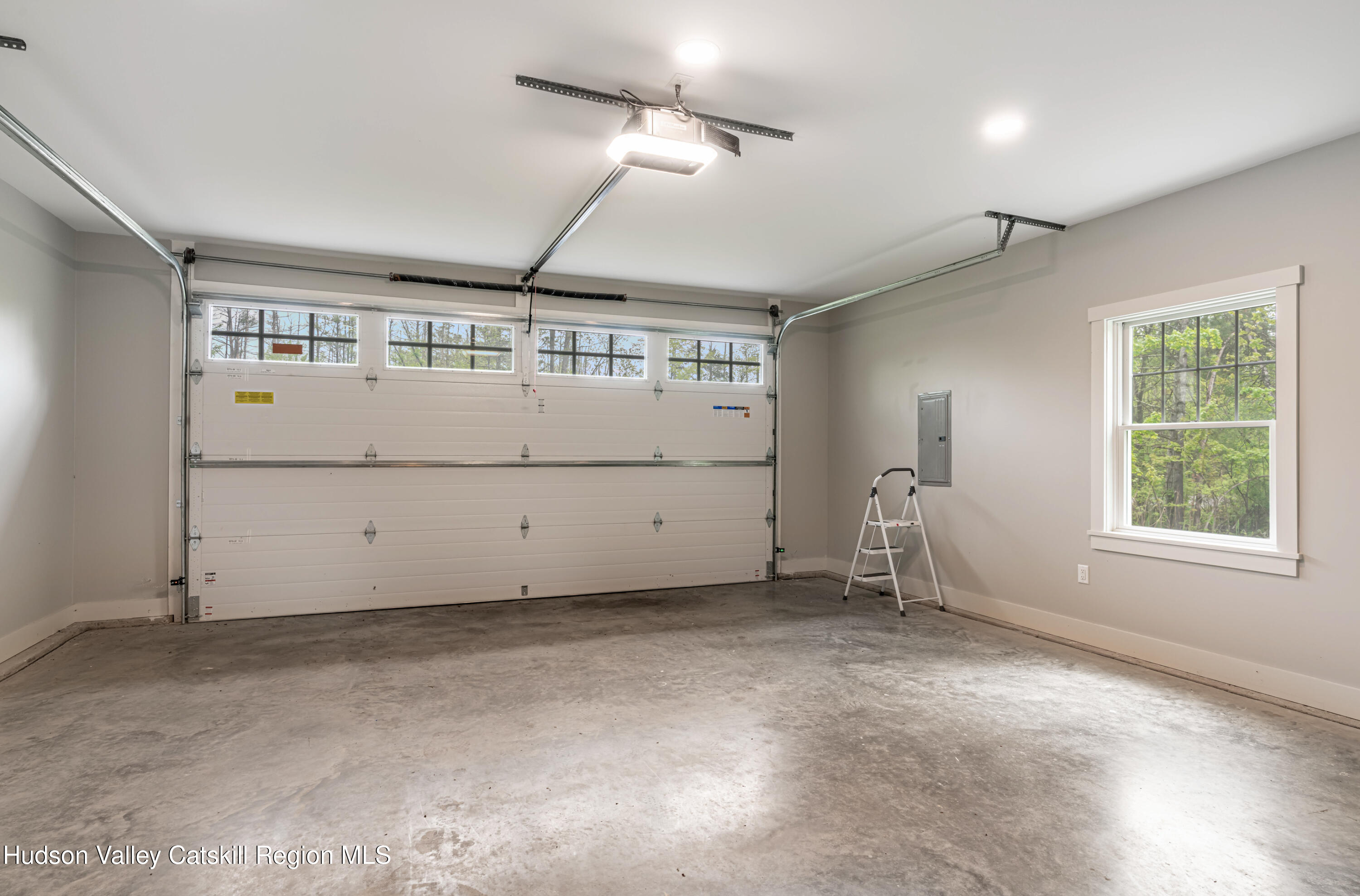 1980 Sleepy Hollow Road Athens, NY 12015 - Photo 27 of 40 a view of a livingroom with a projector & cabinets