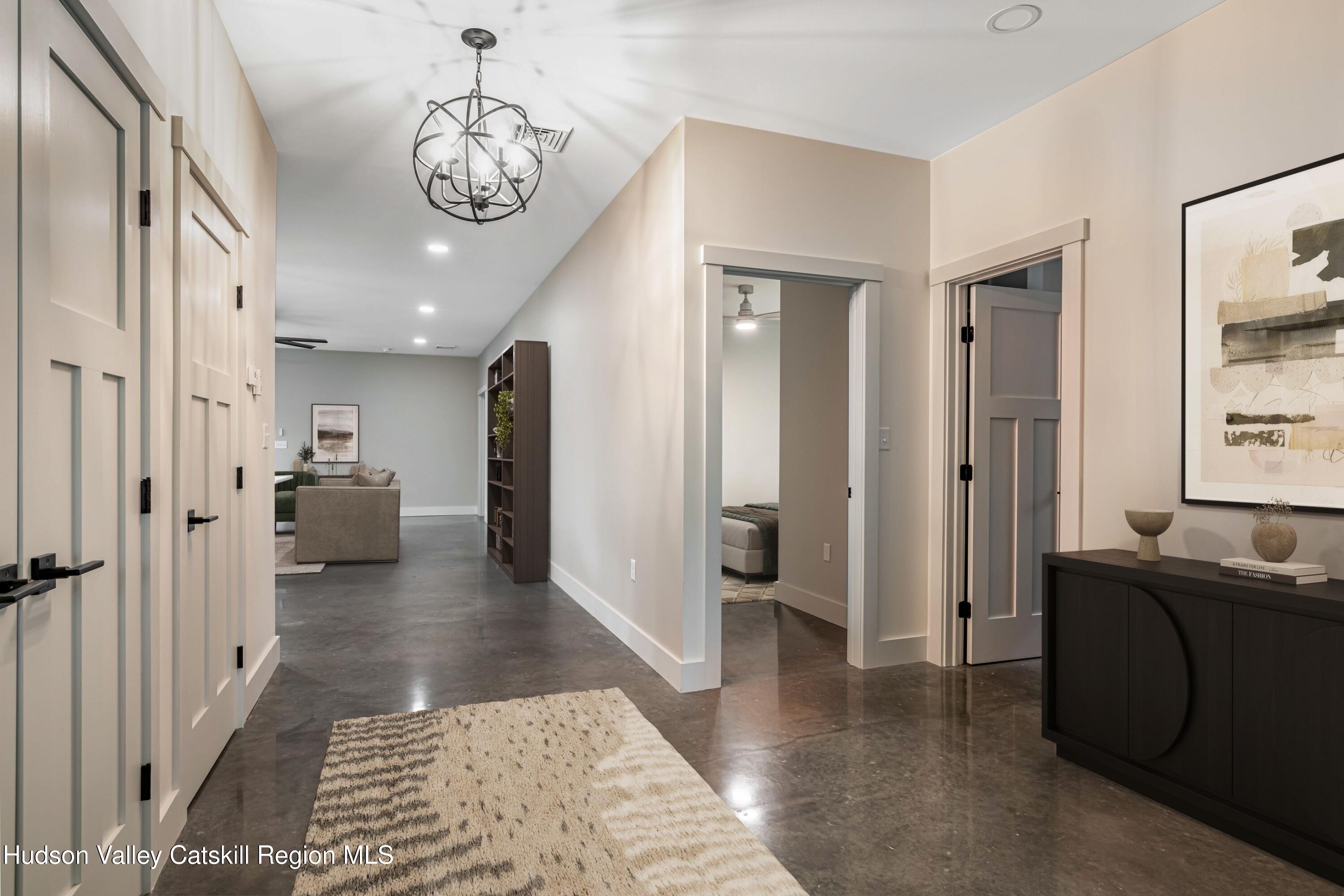 1980 Sleepy Hollow Road Athens, NY 12015 - Photo 3 of 40 a living room with furniture and a chandelier