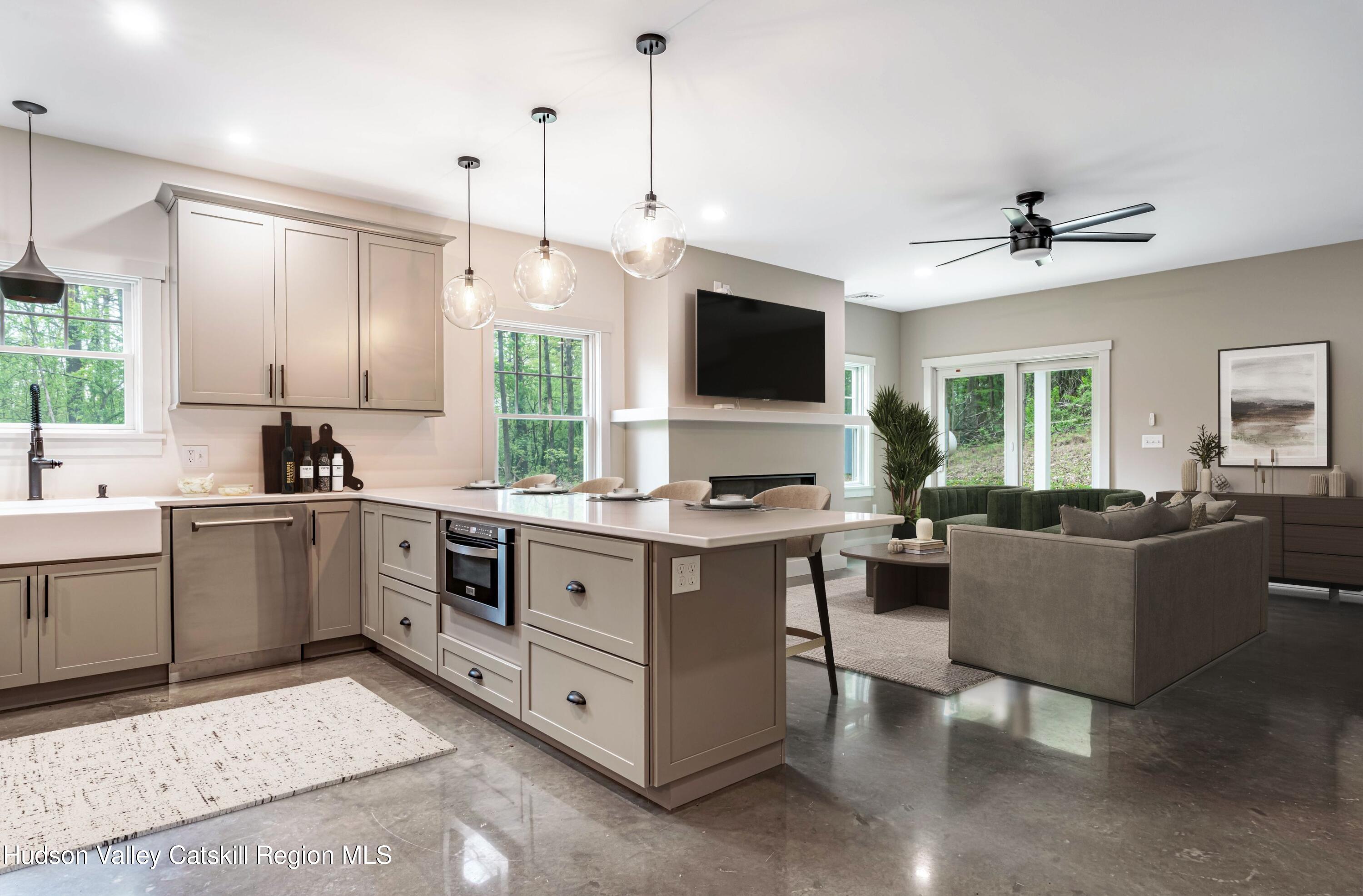 1980 Sleepy Hollow Road Athens, NY 12015 - Photo 5 of 40 a kitchen with kitchen island granite countertop a sink counter top space appliances and a window