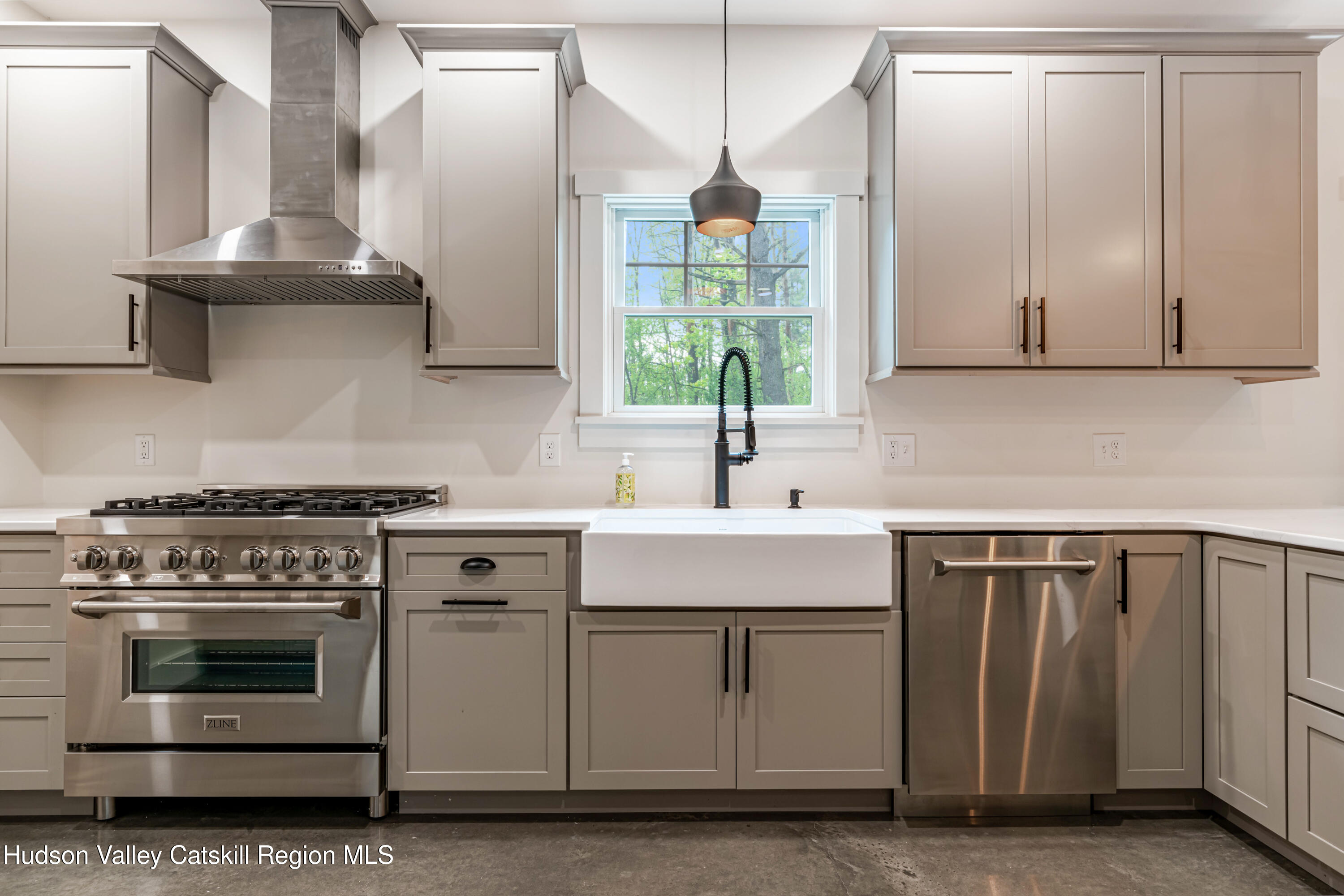 1980 Sleepy Hollow Road Athens, NY 12015 - Photo 6 of 40 a kitchen with stainless steel appliances a sink stove and cabinets