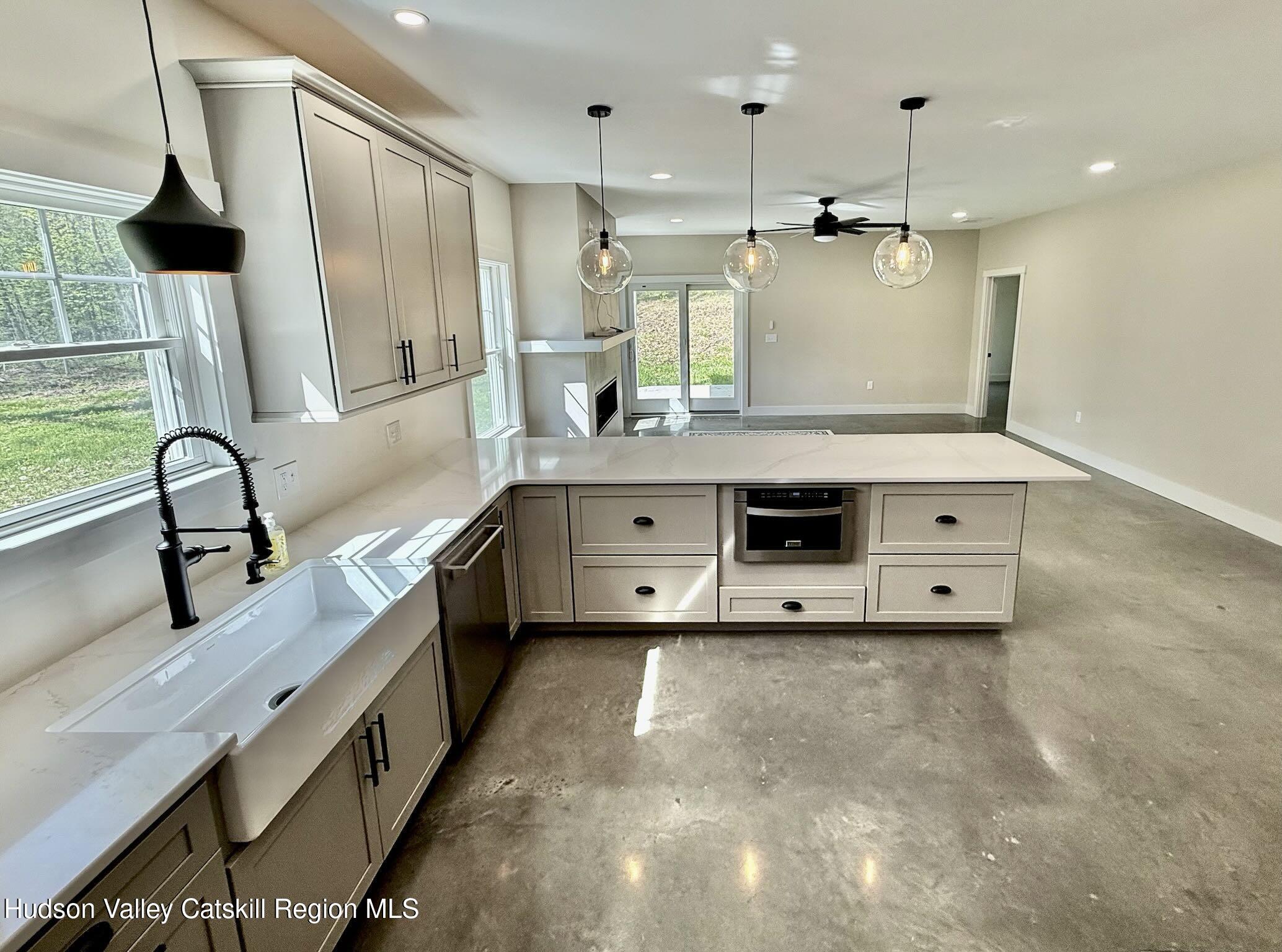 1980 Sleepy Hollow Road Athens, NY 12015 - Photo 8 of 40 a kitchen with stainless steel appliances a sink stove and a refrigerator